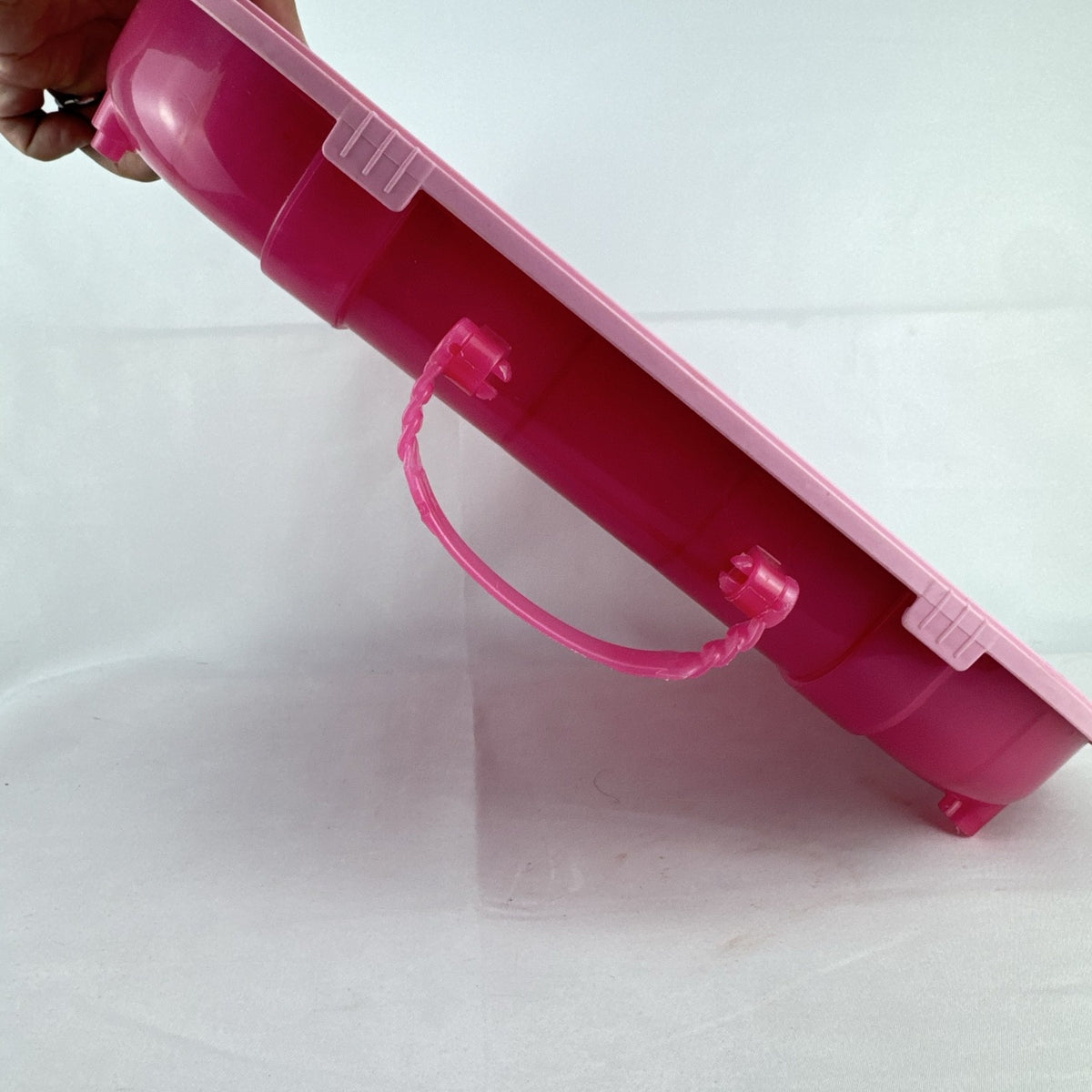 MGA Entertainment L.O.L. Surprise! pink doll carrying case and runway display stand