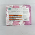 The Peanutshell 4-pack microfiber fitted crib sheets in pink floral and butterfly patterns, factory sealed packaging.