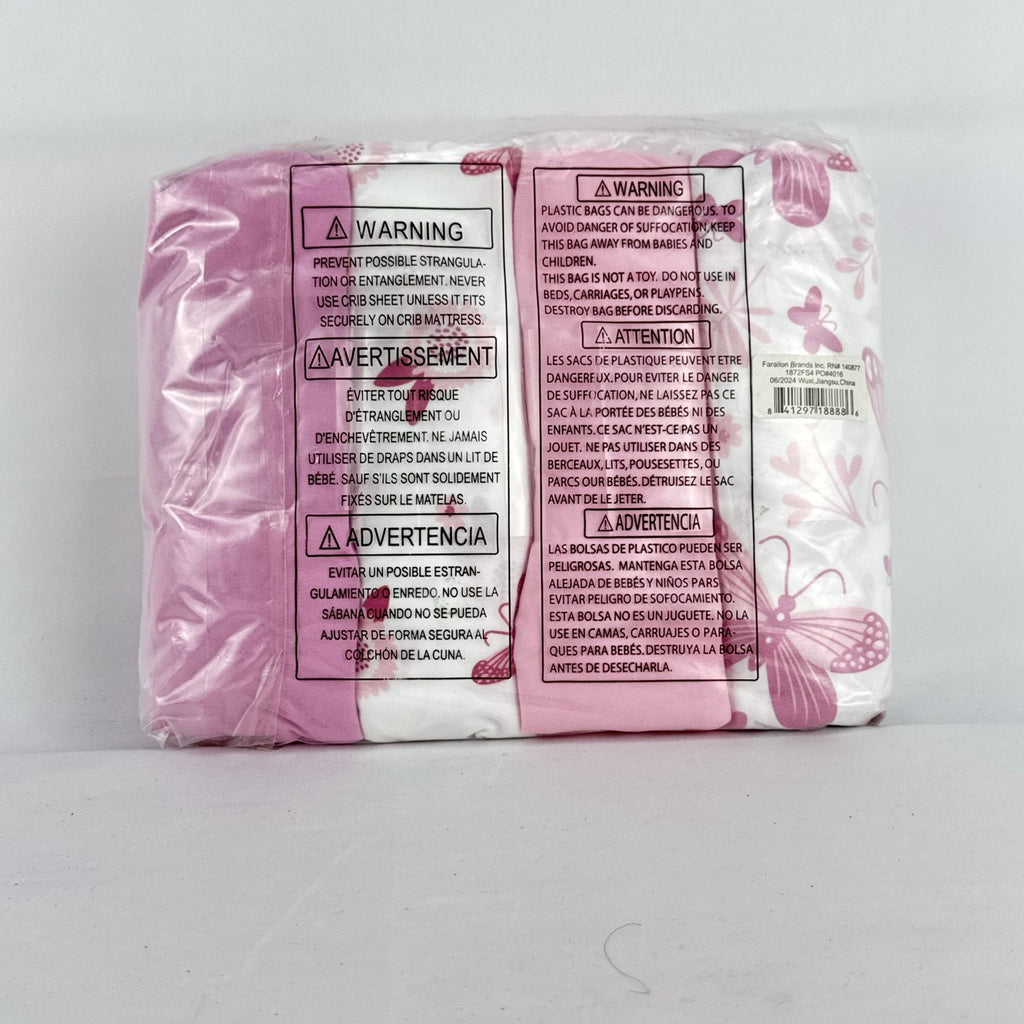 The Peanutshell 4-pack microfiber fitted crib sheets in pink floral and butterfly patterns, factory sealed packaging.