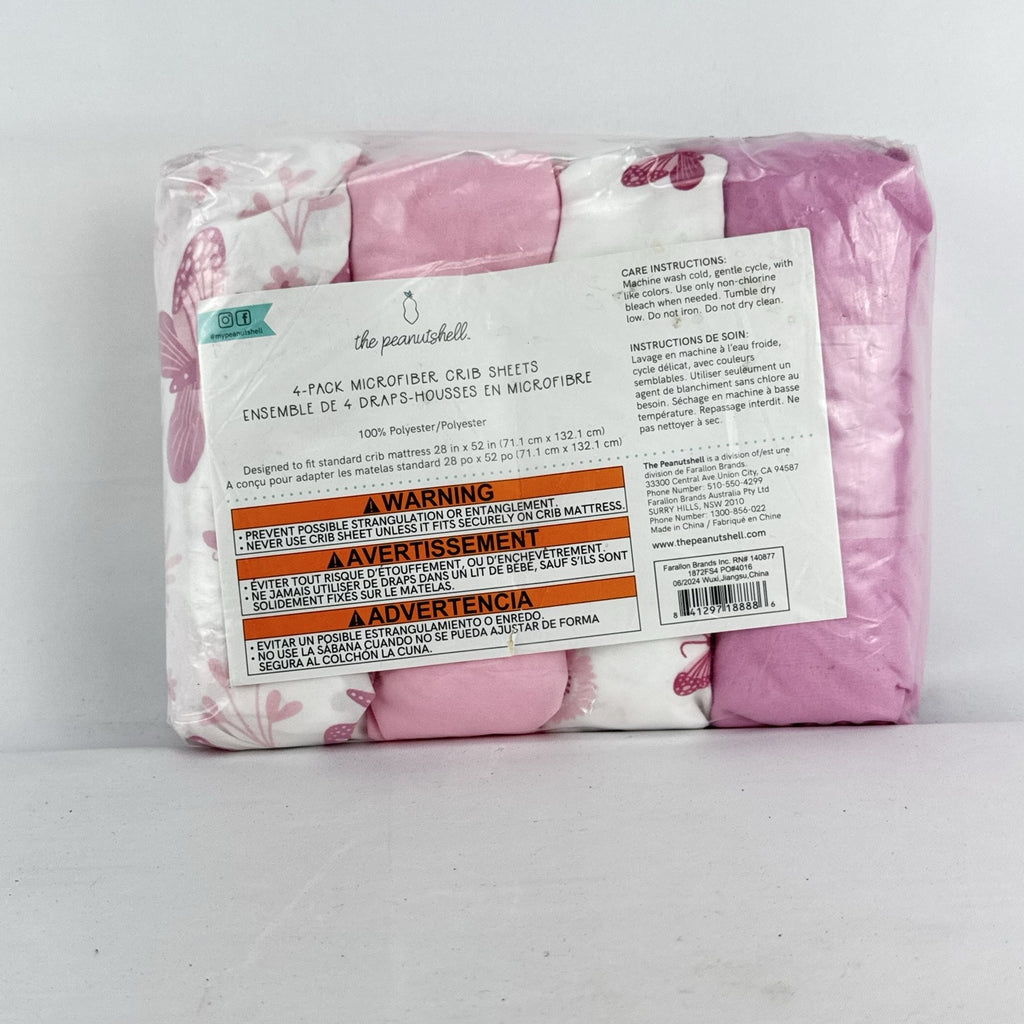 The Peanutshell 4-pack pink floral and butterfly microfiber fitted crib sheets in original packaging
