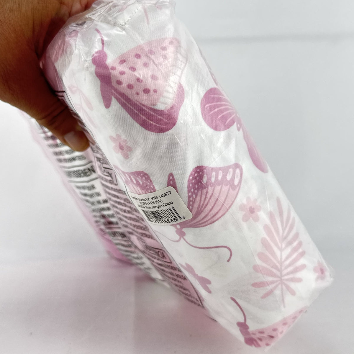 The Peanutshell 4-pack pink floral and butterfly microfiber fitted crib sheets in original packaging