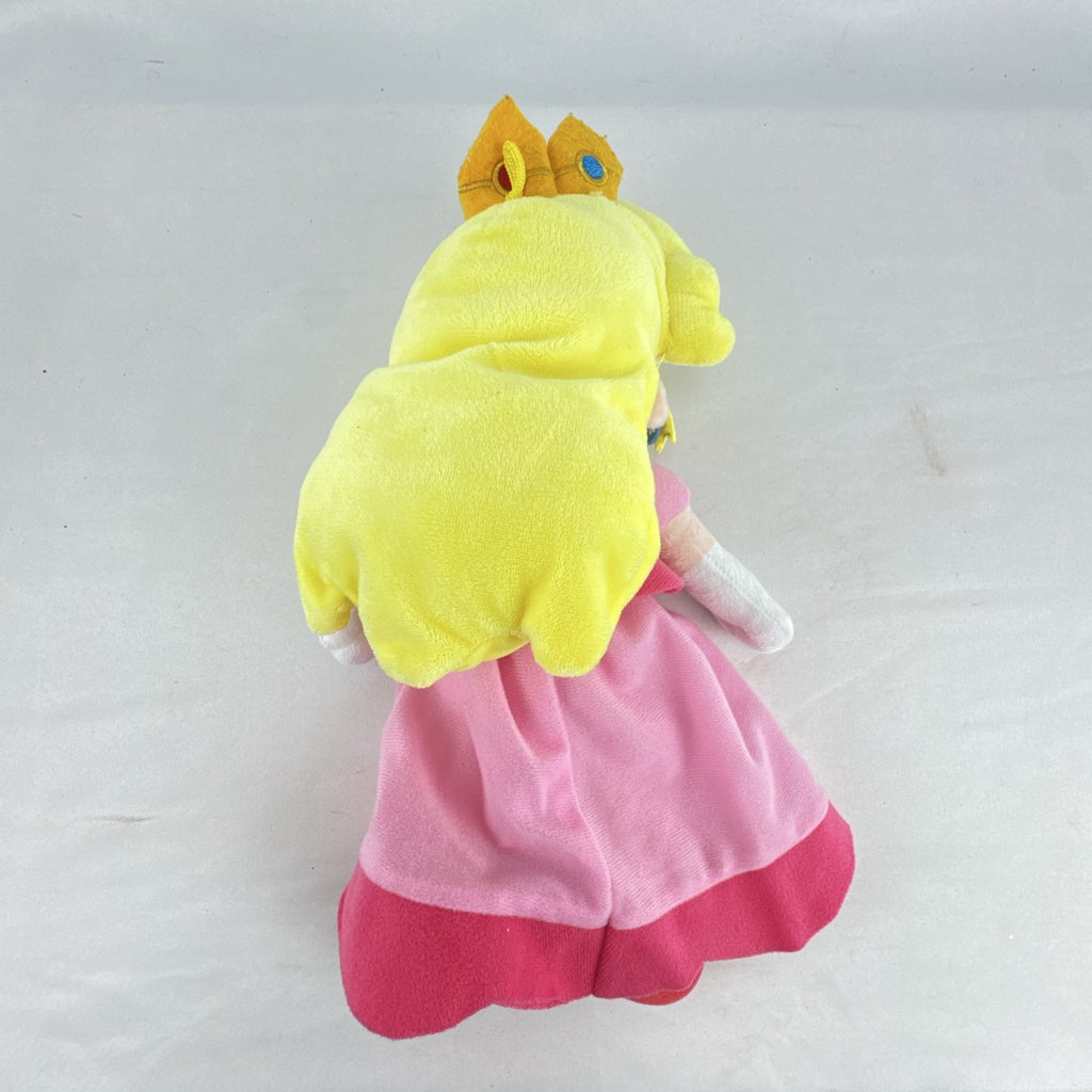Nintendo Super Mario Princess Peach 11-inch plush doll wearing pink dress and crown