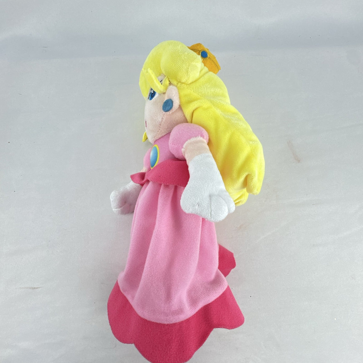 Nintendo Super Mario Princess Peach 11-inch plush doll wearing pink dress and crown
