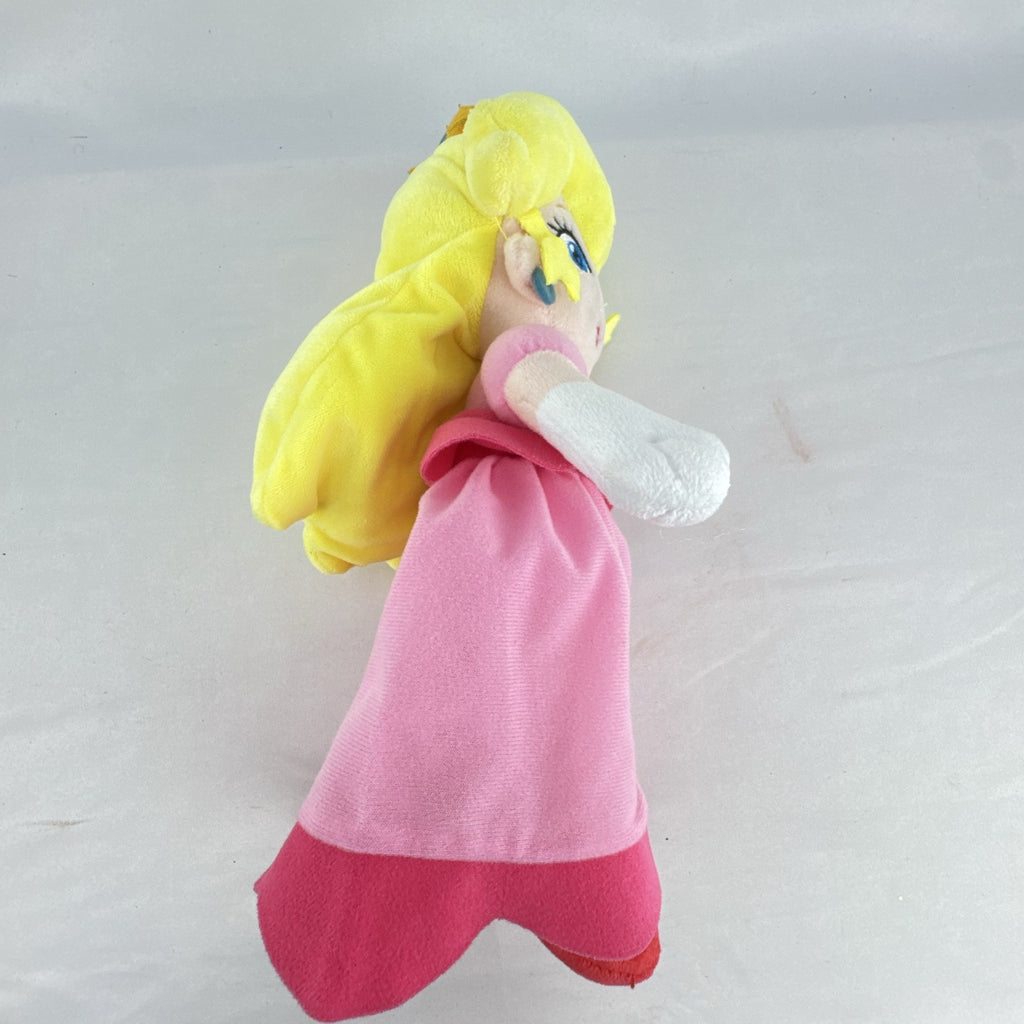 Nintendo Super Mario Princess Peach 11-inch plush doll wearing pink dress and crown