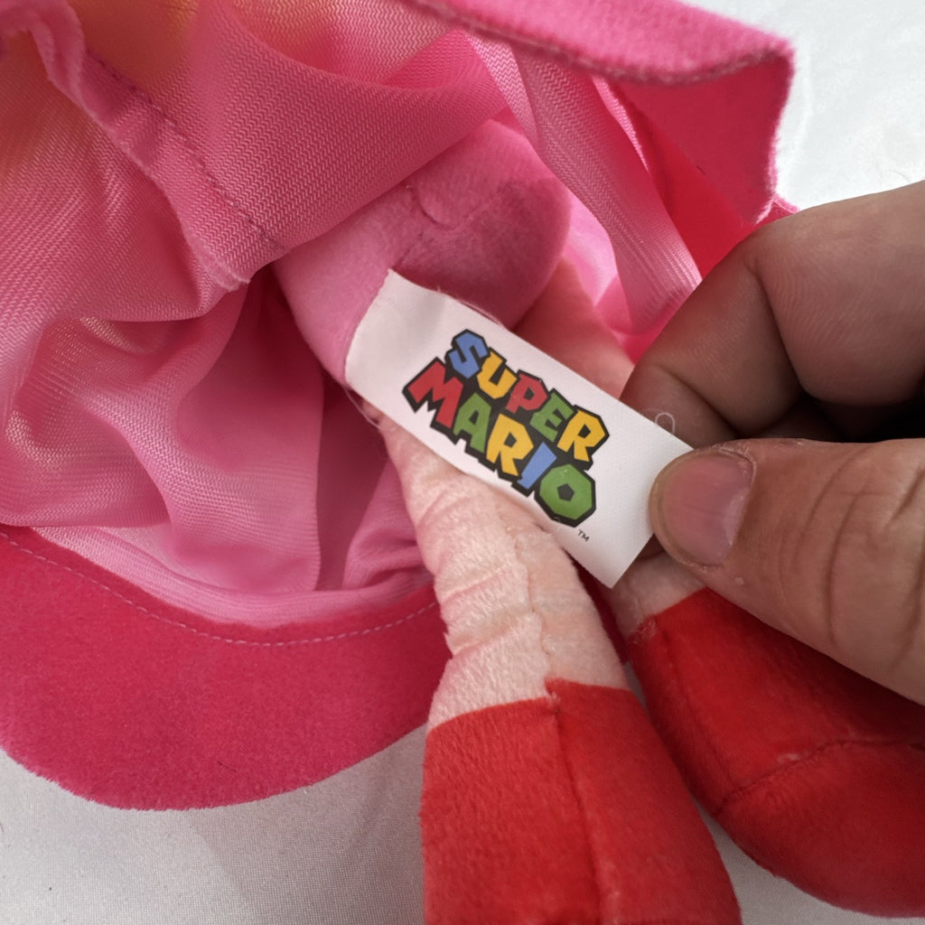 Nintendo Super Mario Princess Peach 11-inch plush doll wearing pink dress and crown