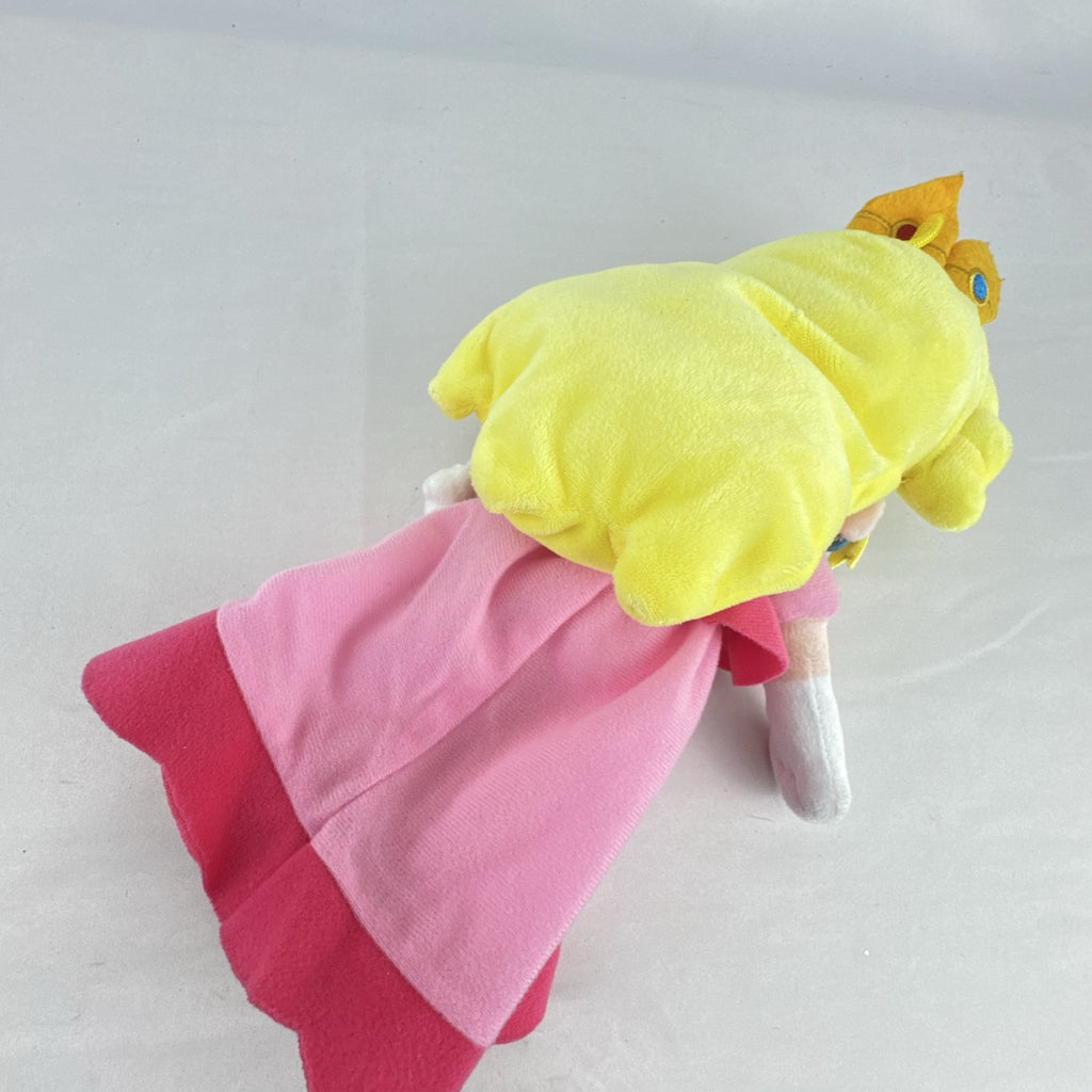 Nintendo Super Mario Princess Peach 11-inch plush doll wearing pink dress and crown