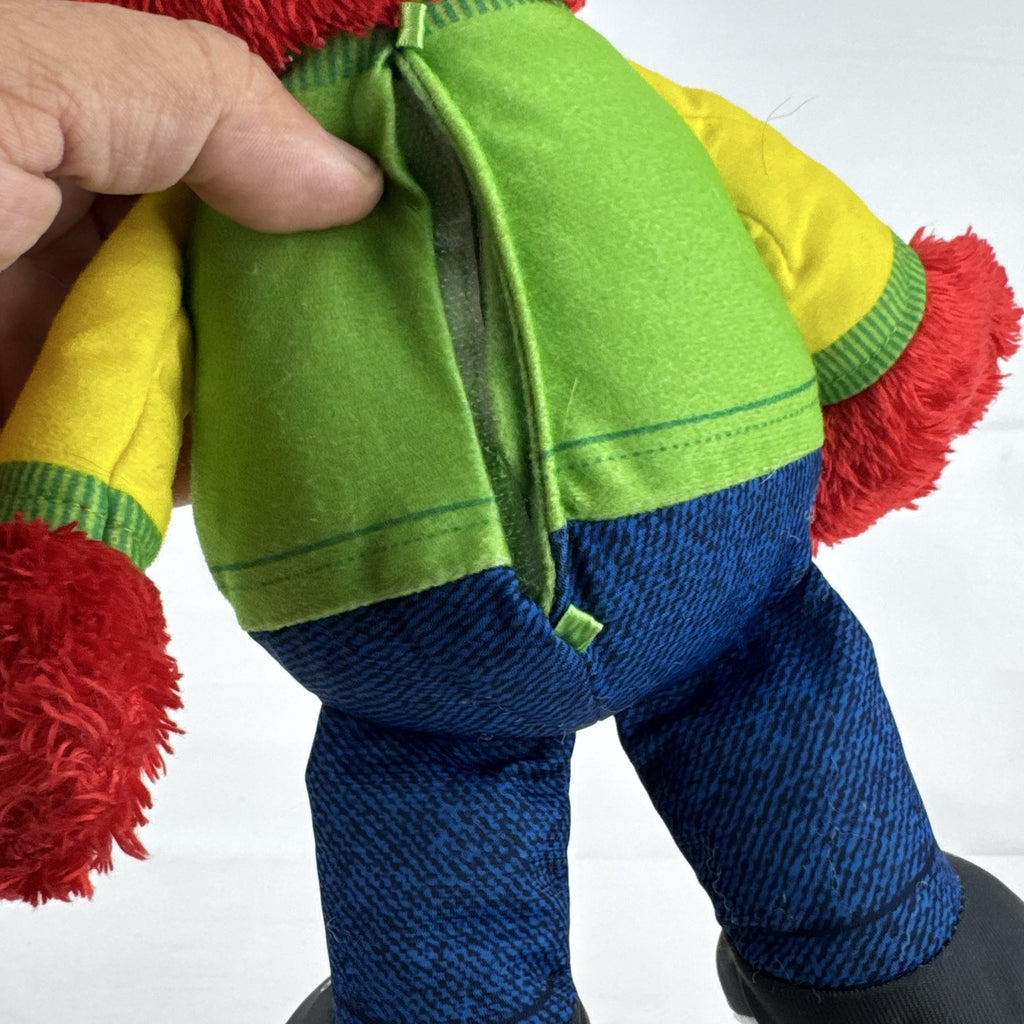 Hasbro Sesame Street ABC Elmo 12-inch plush toy wearing a colorblock alphabet shirt and sneakers.