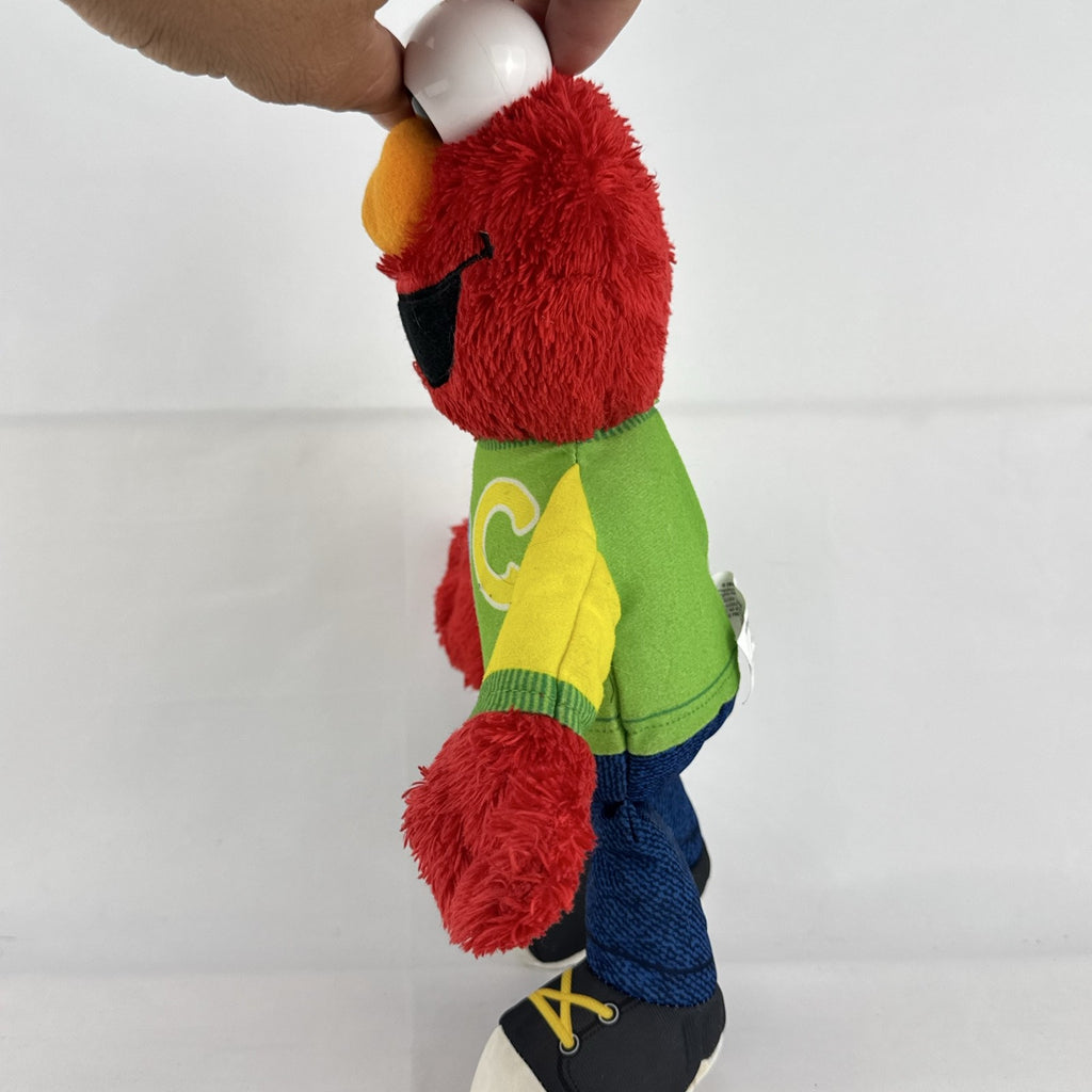 Hasbro Sesame Street ABC Elmo 12-inch plush toy wearing a colorblock alphabet shirt and sneakers.