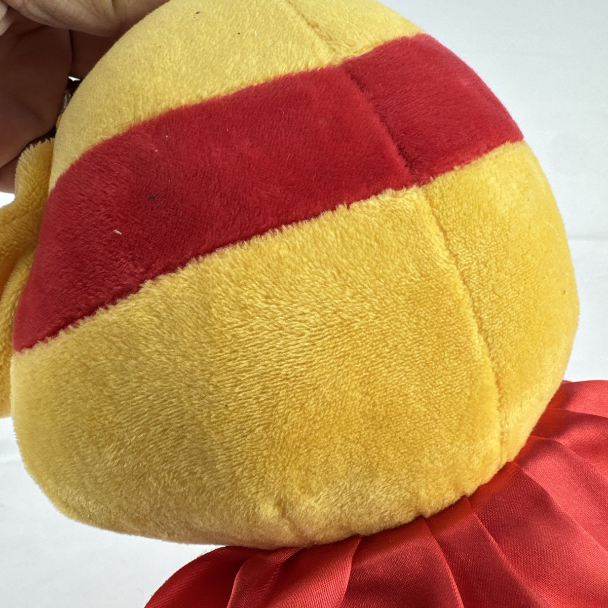 Kiddopia 12-inch yellow superhero dog plush toy wearing a red satin cape and embroidered eye mask.