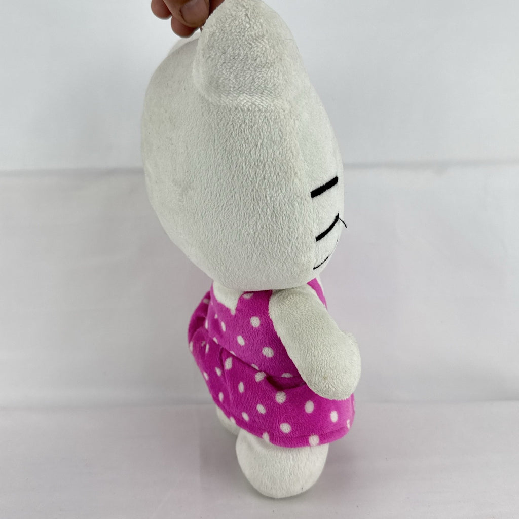 Sanrio 11-inch Hello Kitty plush wearing a pink polka dot dress with a purple flower