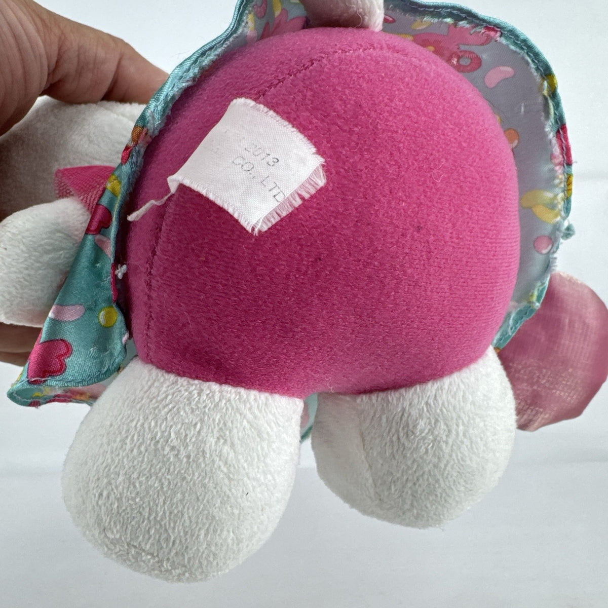 Sanrio Hello Kitty 9-inch plush doll wearing a teal candy print satin dress and holding a pink swirl lollipop.
