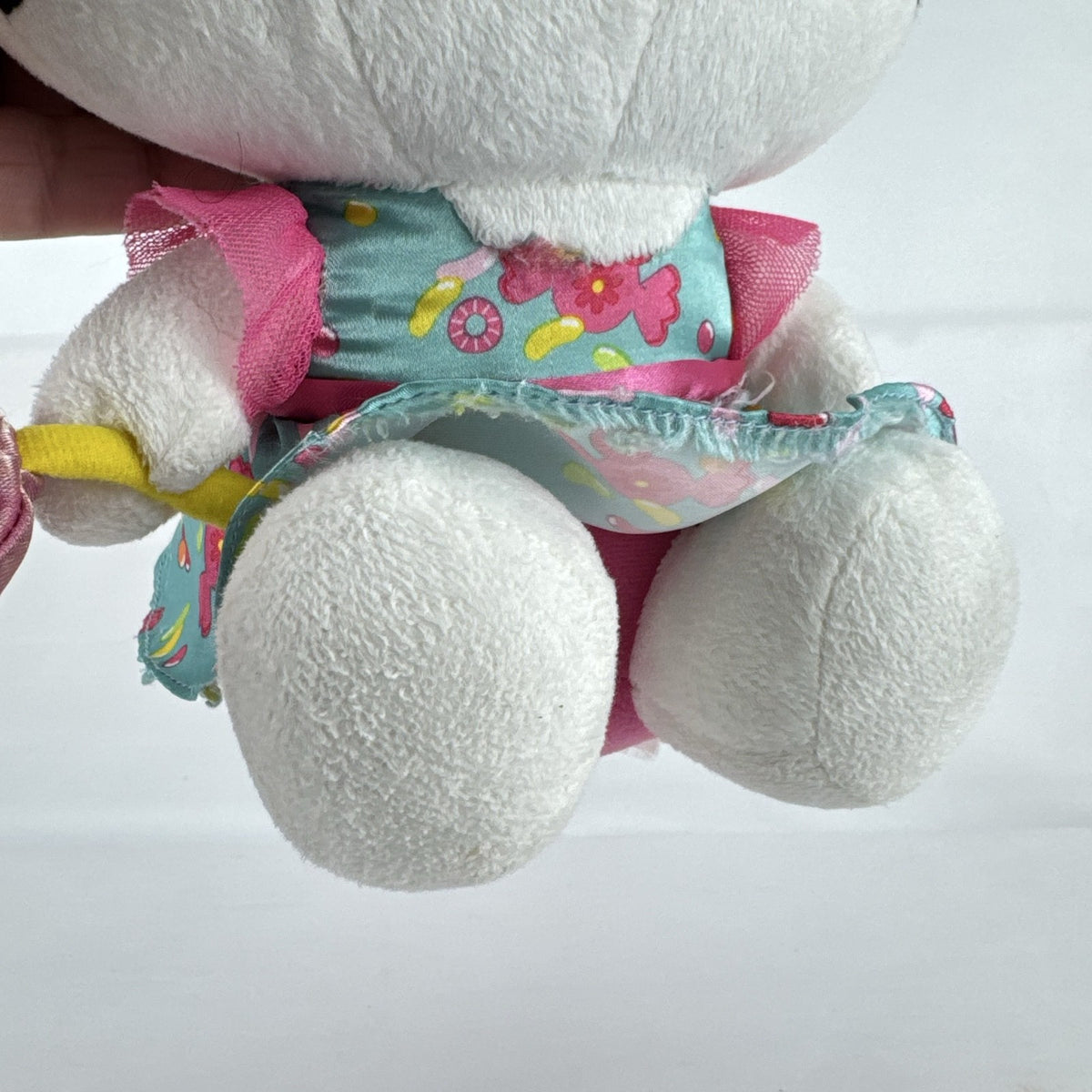 Sanrio Hello Kitty 9-inch plush doll wearing a teal candy print satin dress and holding a pink swirl lollipop.