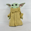Disney Store 11-inch Grogu plush doll wearing a tan faux-suede coat with fleece trim