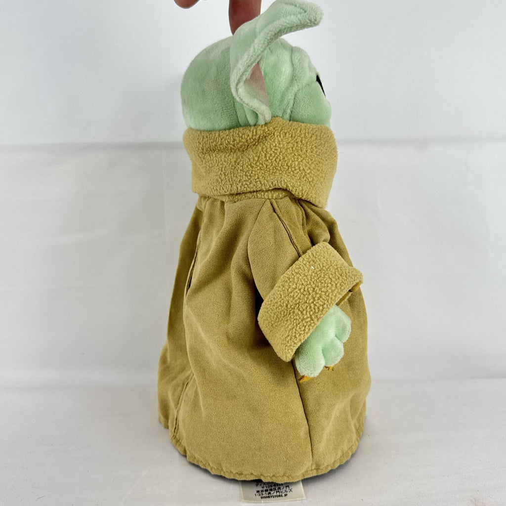 Disney Store 11-inch Grogu plush doll wearing a tan faux-suede coat with fleece trim