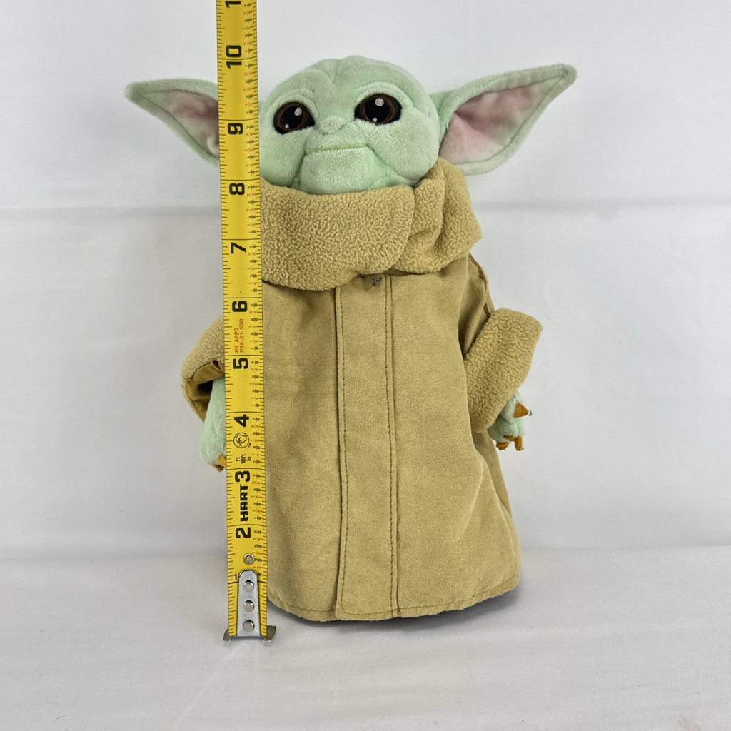 Disney Store 11-inch Grogu plush doll wearing a tan faux-suede coat with fleece trim
