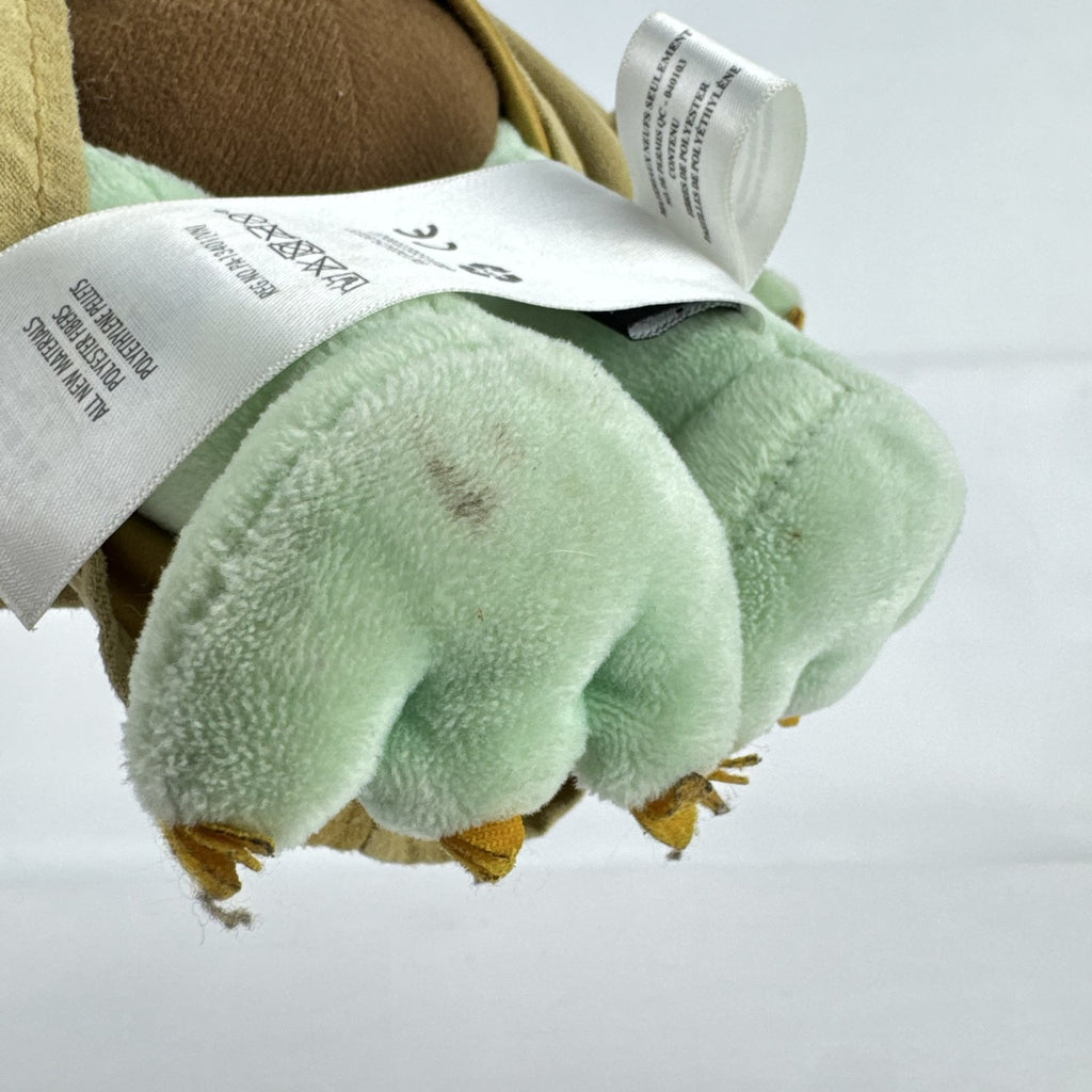 Disney Store 11-inch Grogu plush doll wearing a tan faux-suede coat with fleece trim