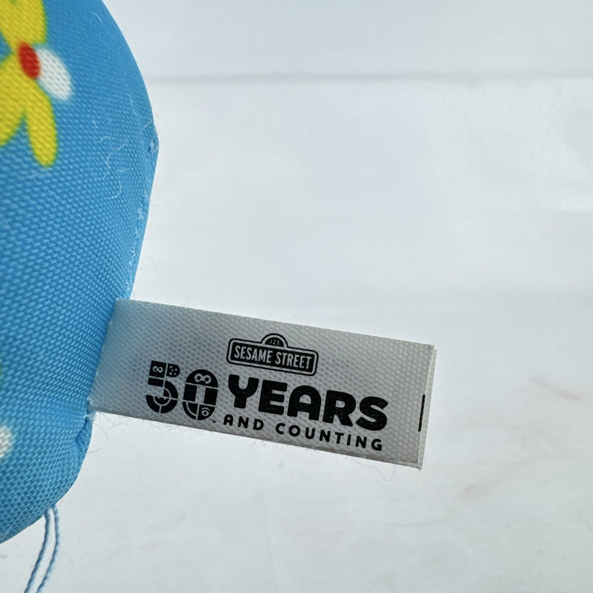 Sesame Street 50th Anniversary Abby Cadabby fairy roll plush stuffed toy with wings and floral pattern