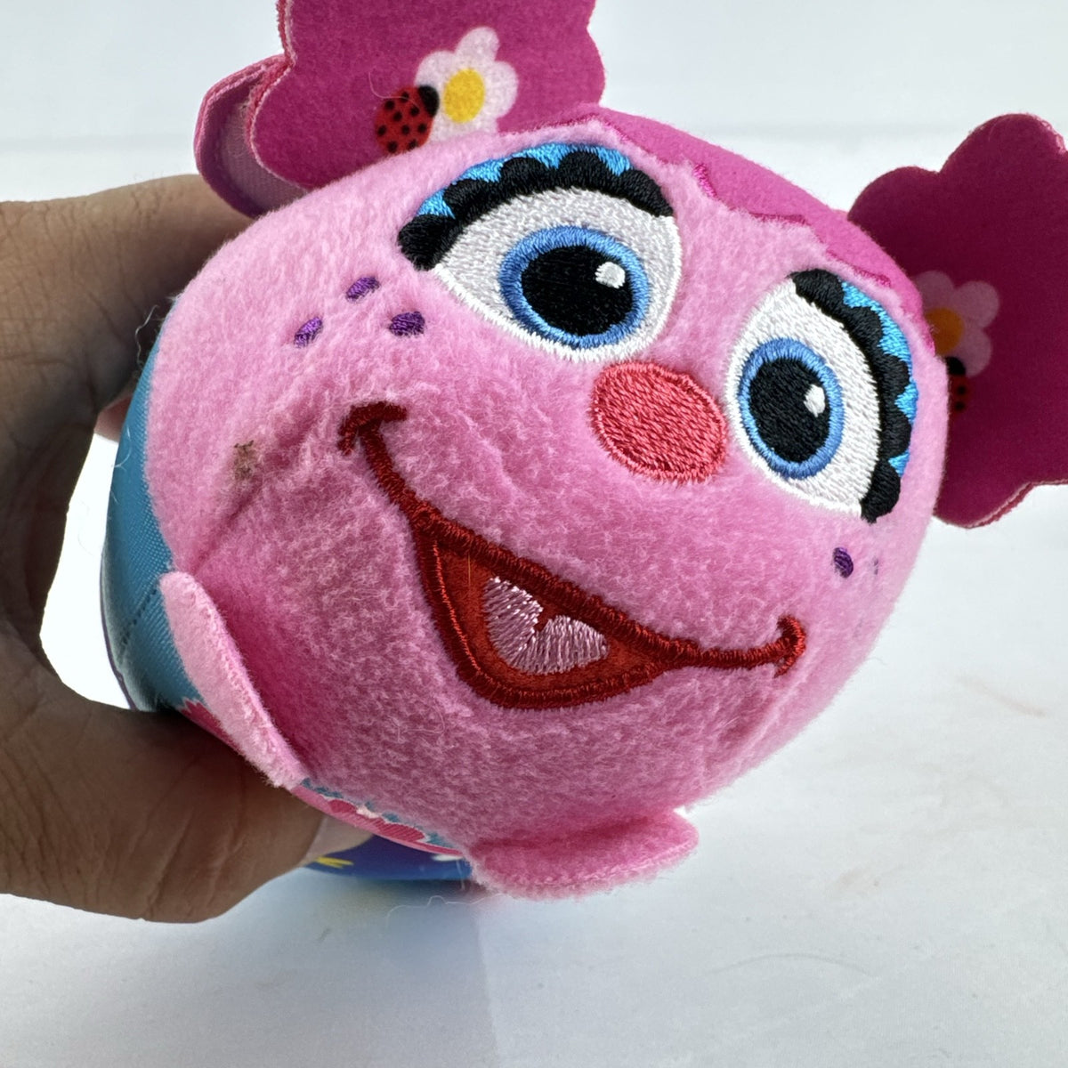 Sesame Street 50th Anniversary Abby Cadabby fairy roll plush stuffed toy with wings and floral pattern