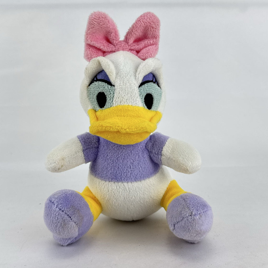 Kids Preferred Disney Baby Daisy Duck seated plush in purple outfit with pink bow