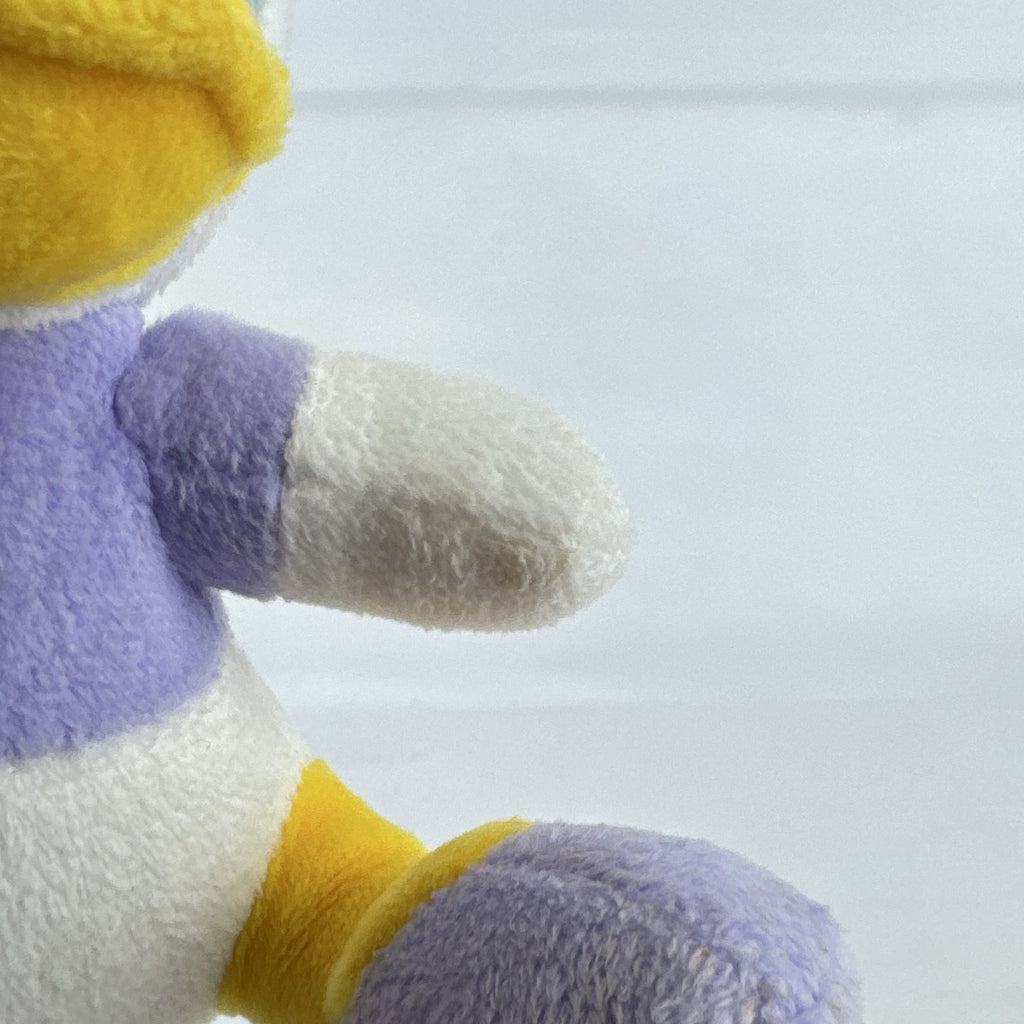 Kids Preferred Disney Baby Daisy Duck seated plush in purple outfit with pink bow