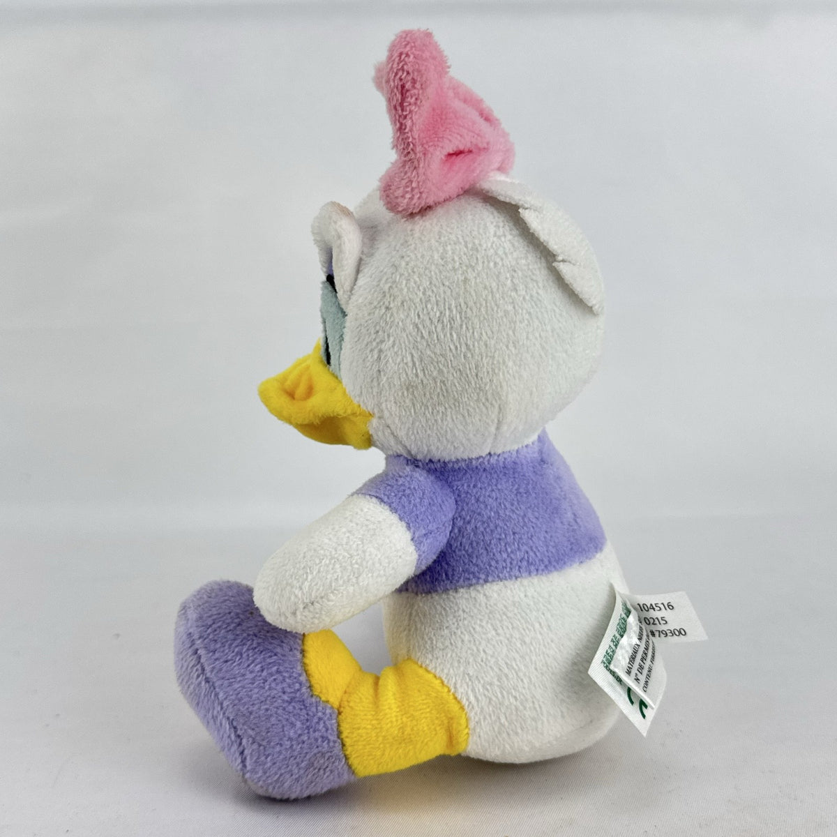 Kids Preferred Disney Baby Daisy Duck seated plush in purple outfit with pink bow