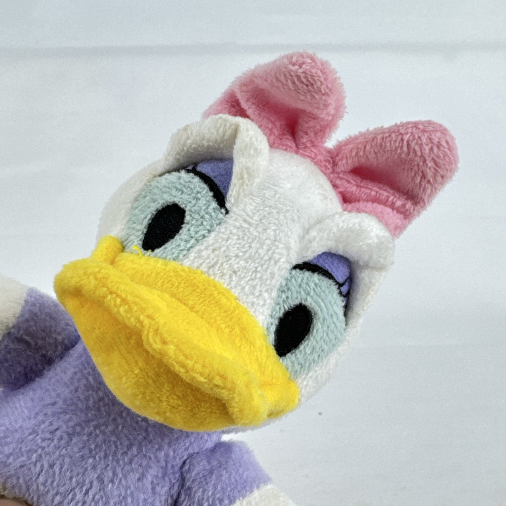 Kids Preferred Disney Baby Daisy Duck seated plush in purple outfit with pink bow