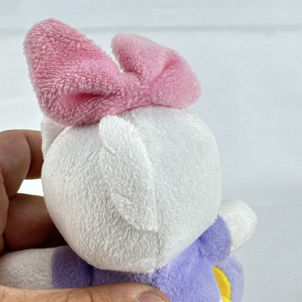 Kids Preferred Disney Baby Daisy Duck seated plush in purple outfit with pink bow