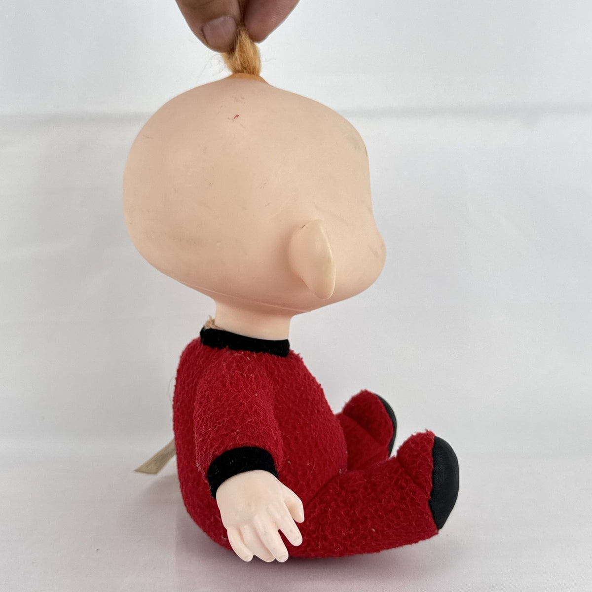Disney Incredibles Jack-Jack plush doll with vinyl head and rooted hair in a red superhero suit
