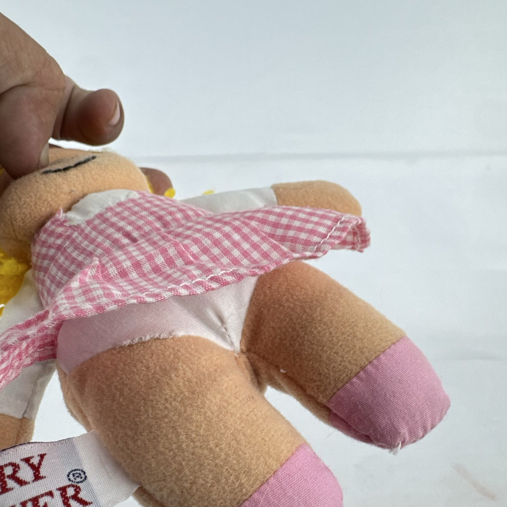 Mary Meyer 7-inch plush rag doll with yellow yarn pigtails and pink gingham dress