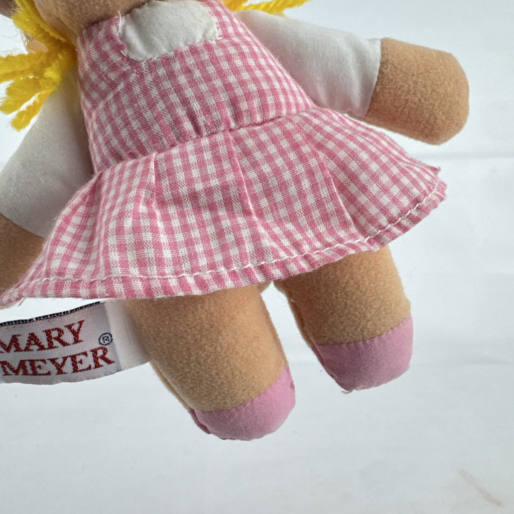 Mary Meyer 7-inch plush rag doll with yellow yarn pigtails and pink gingham dress