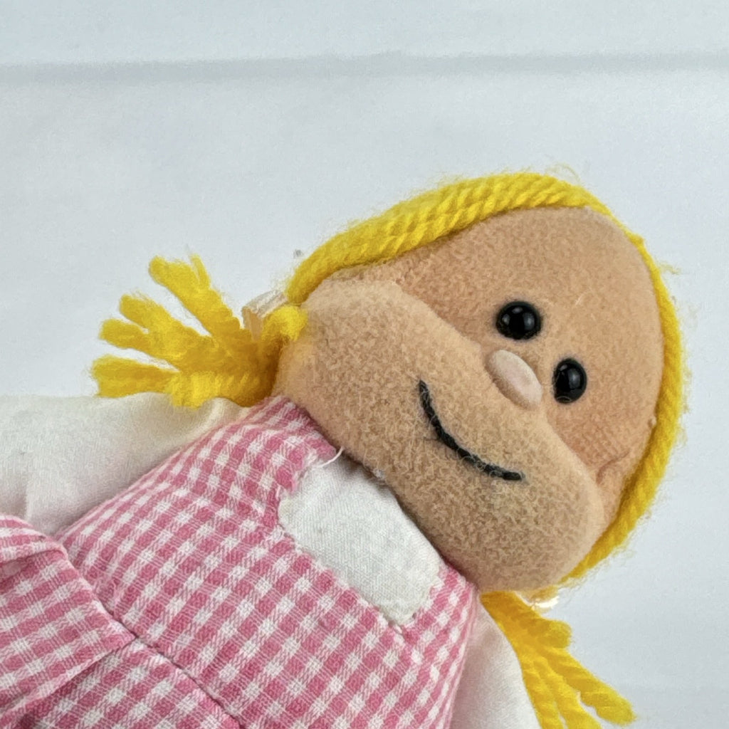 Mary Meyer 7-inch plush rag doll with yellow yarn pigtails and pink gingham dress