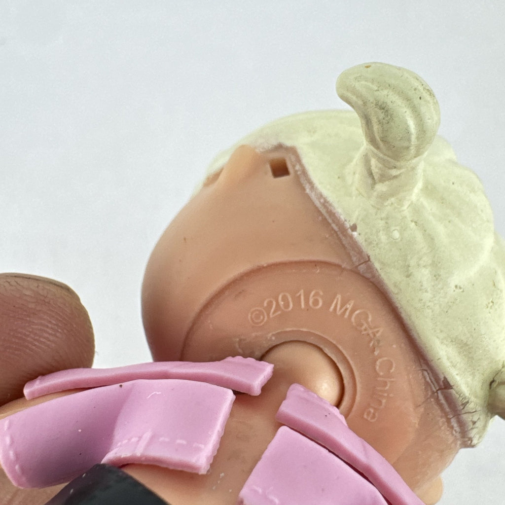 MGA L.O.L. Surprise! Biker Babe 3-inch doll with blonde sculpted hair, pink moto jacket, and MOM heart tattoo