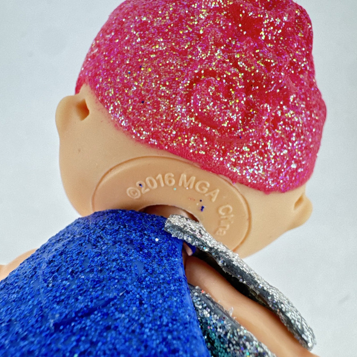 MGA Entertainment LOL Surprise Glitter Series Cosmic Queen 3-inch doll with pink glitter hair and cape