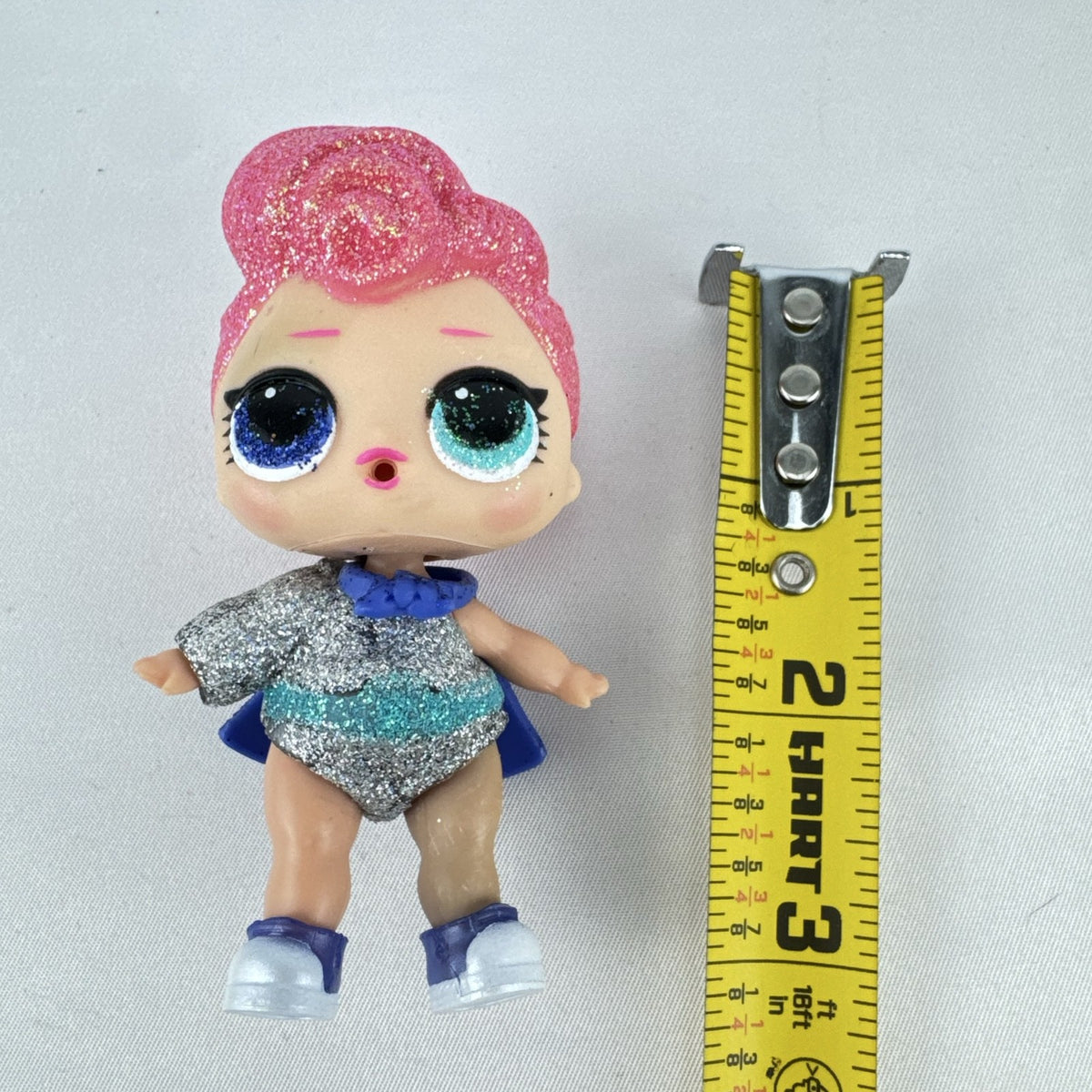 MGA Entertainment LOL Surprise Glitter Series Cosmic Queen 3-inch doll with pink glitter hair and cape