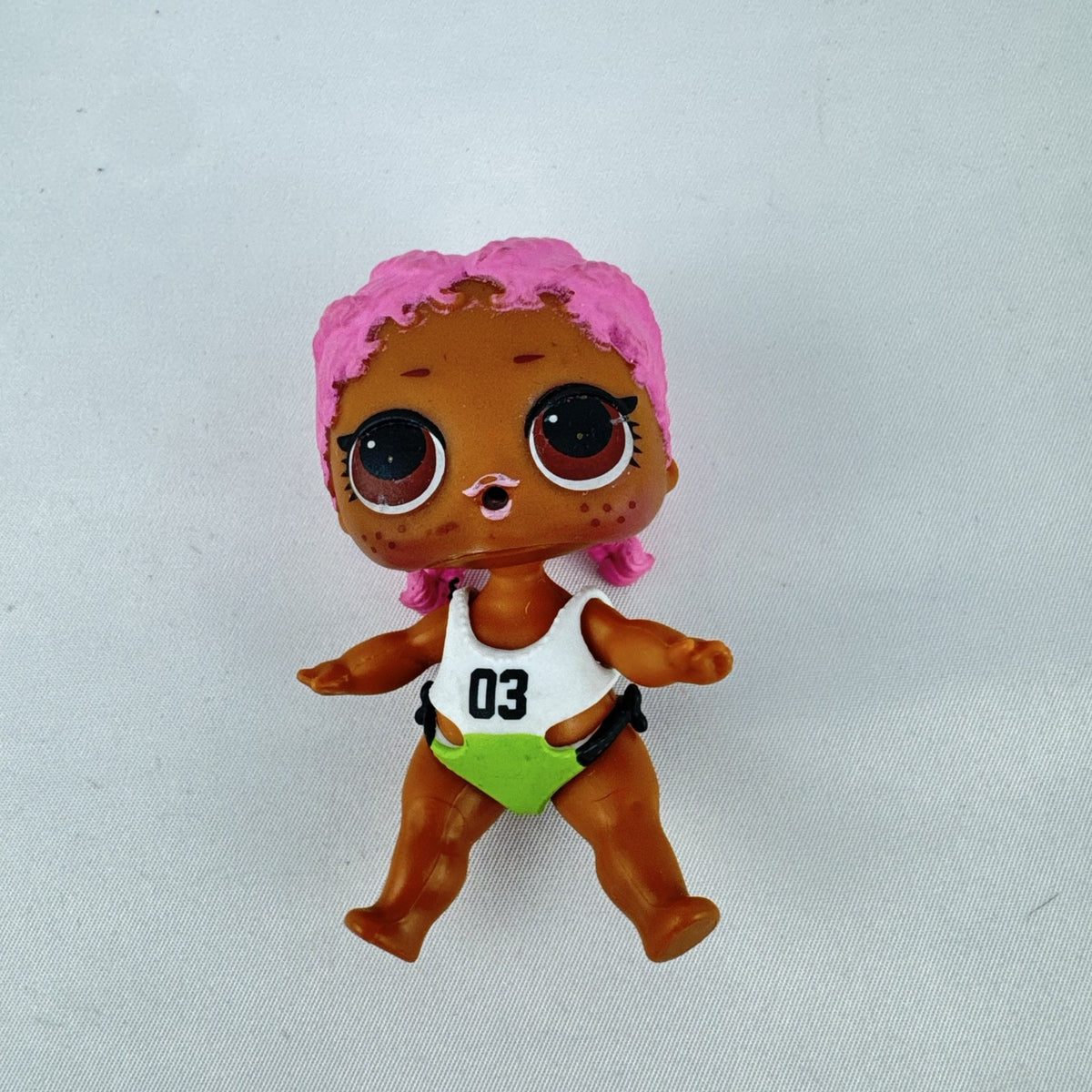 MGA L.O.L. Surprise Series 3 Confetti Pop Sprints doll in athletic outfit with pink braids