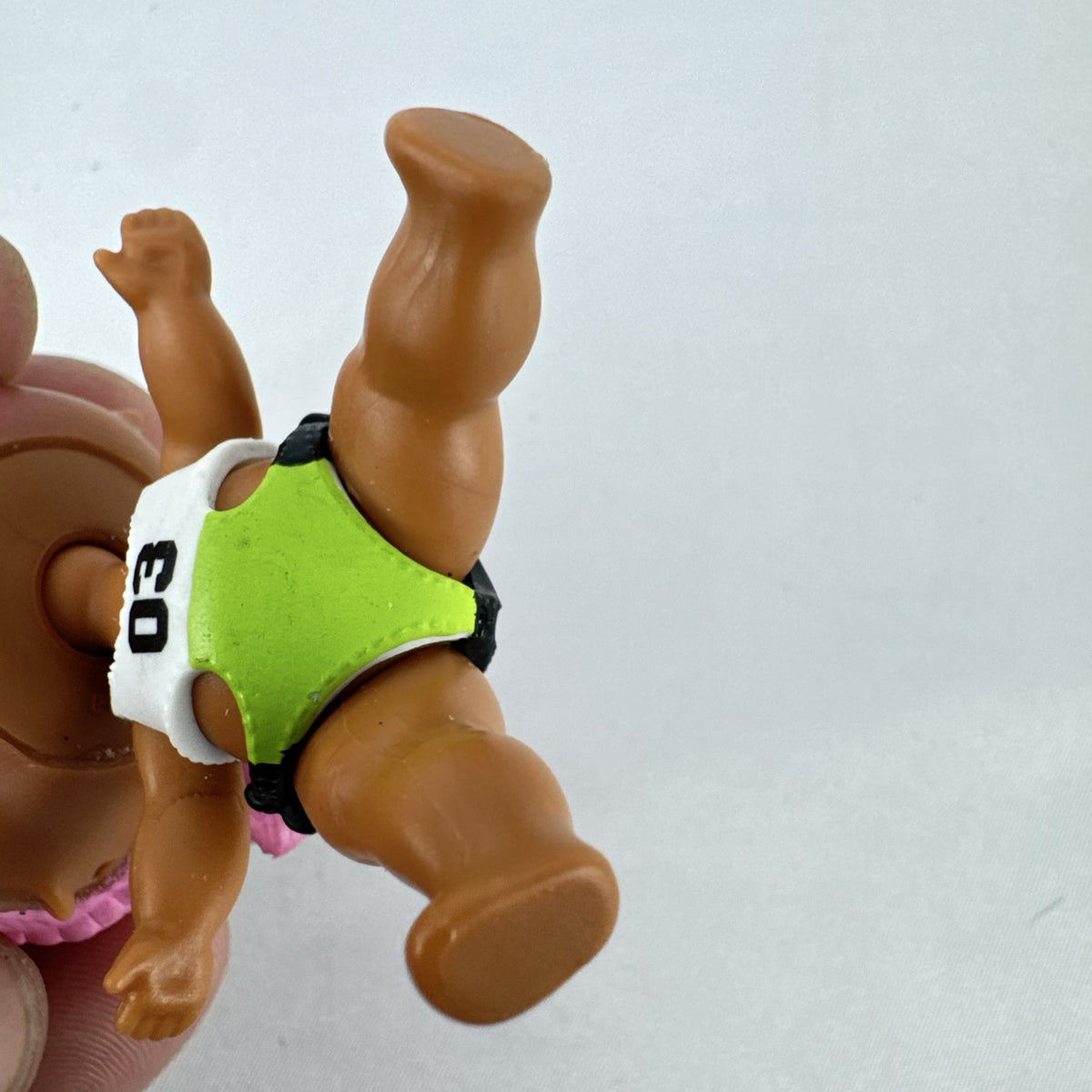 MGA L.O.L. Surprise Series 3 Confetti Pop Sprints doll in athletic outfit with pink braids