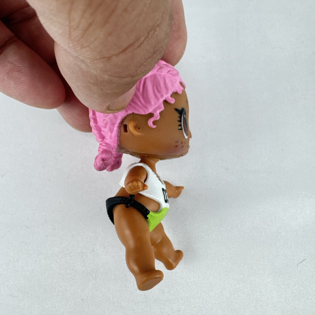 MGA L.O.L. Surprise Series 3 Confetti Pop Sprints doll in athletic outfit with pink braids