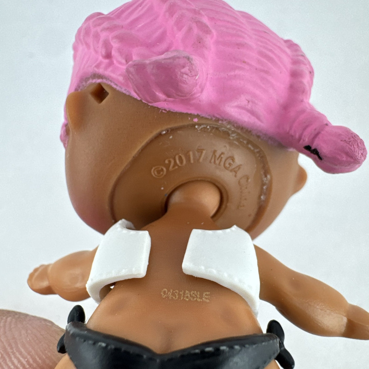 MGA L.O.L. Surprise Series 3 Confetti Pop Sprints doll in athletic outfit with pink braids