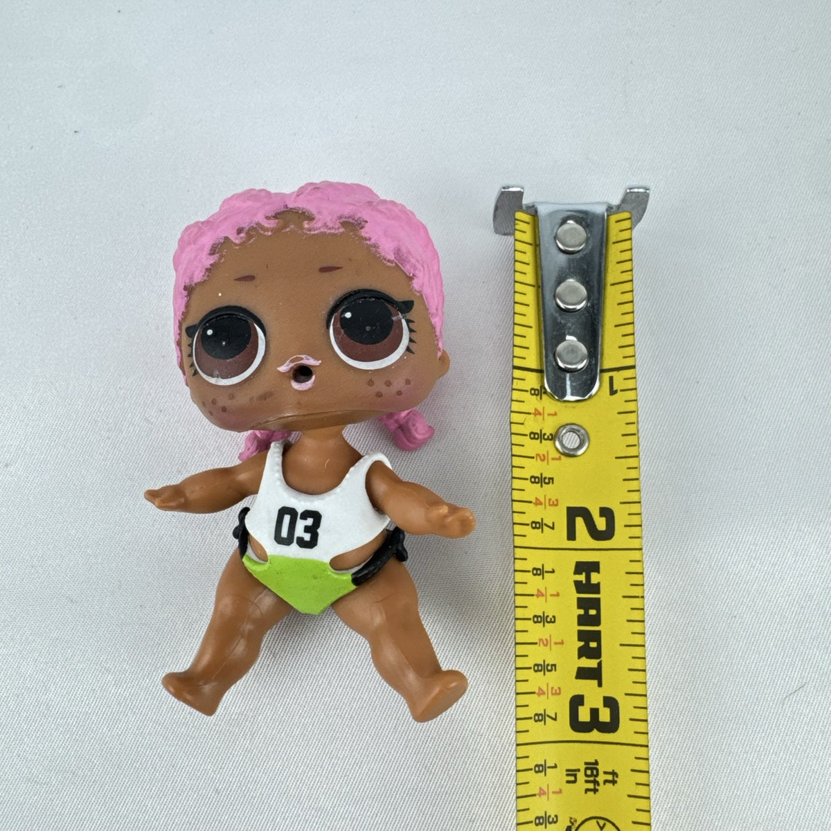 MGA L.O.L. Surprise Series 3 Confetti Pop Sprints doll in athletic outfit with pink braids