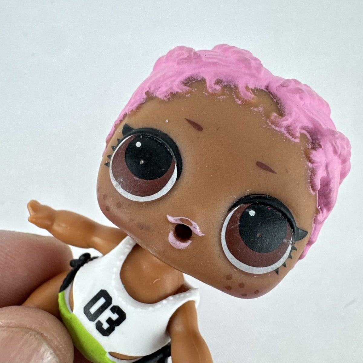 MGA L.O.L. Surprise Series 3 Confetti Pop Sprints doll in athletic outfit with pink braids