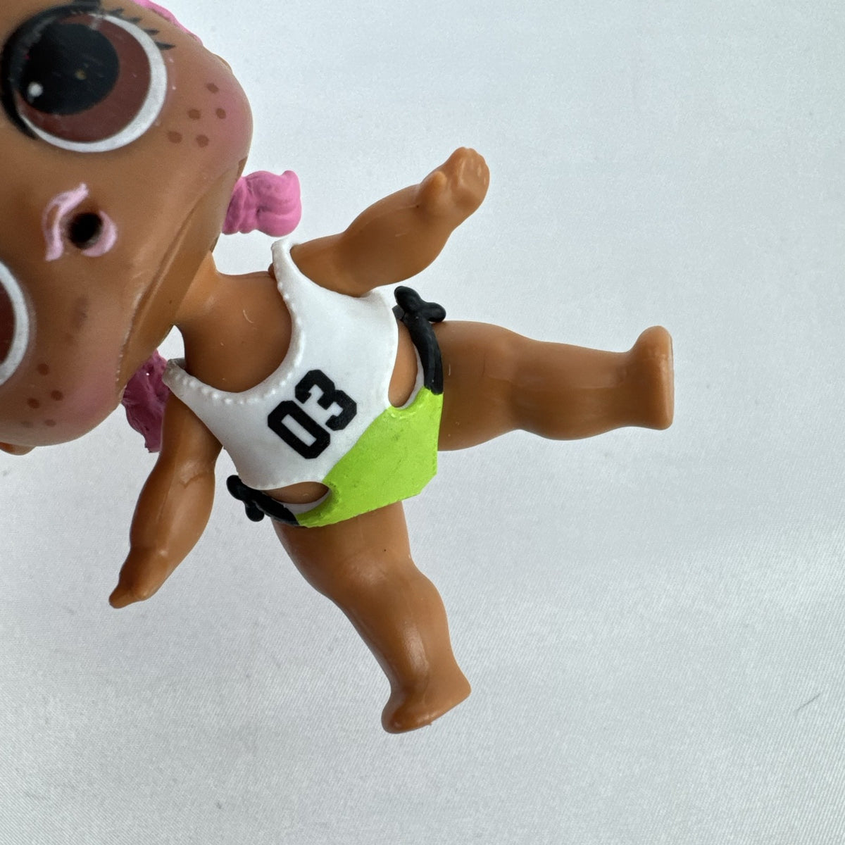 MGA L.O.L. Surprise Series 3 Confetti Pop Sprints doll in athletic outfit with pink braids