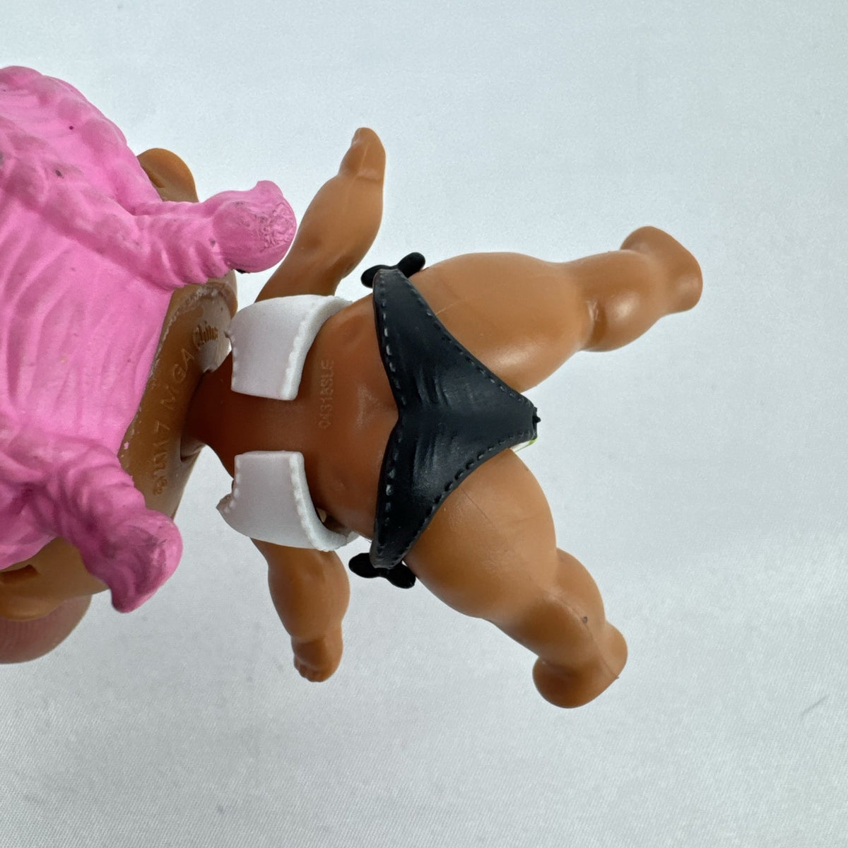 MGA L.O.L. Surprise Series 3 Confetti Pop Sprints doll in athletic outfit with pink braids
