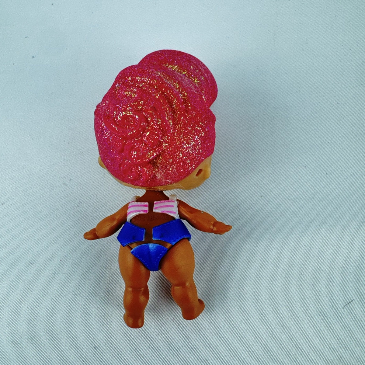 MGA L.O.L. Surprise High Dive doll with pink glitter hair and two-piece swimsuit