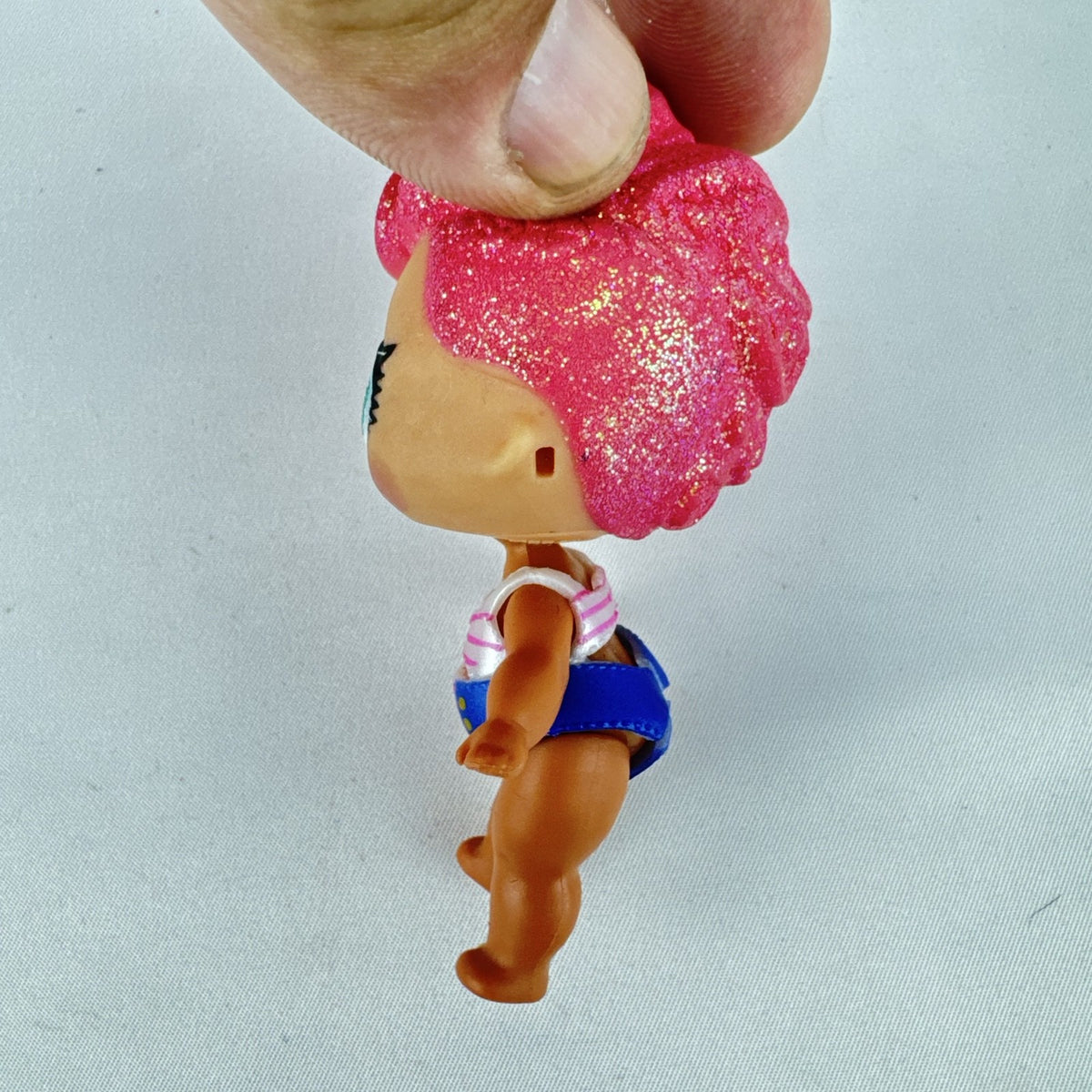 MGA L.O.L. Surprise High Dive doll with pink glitter hair and two-piece swimsuit