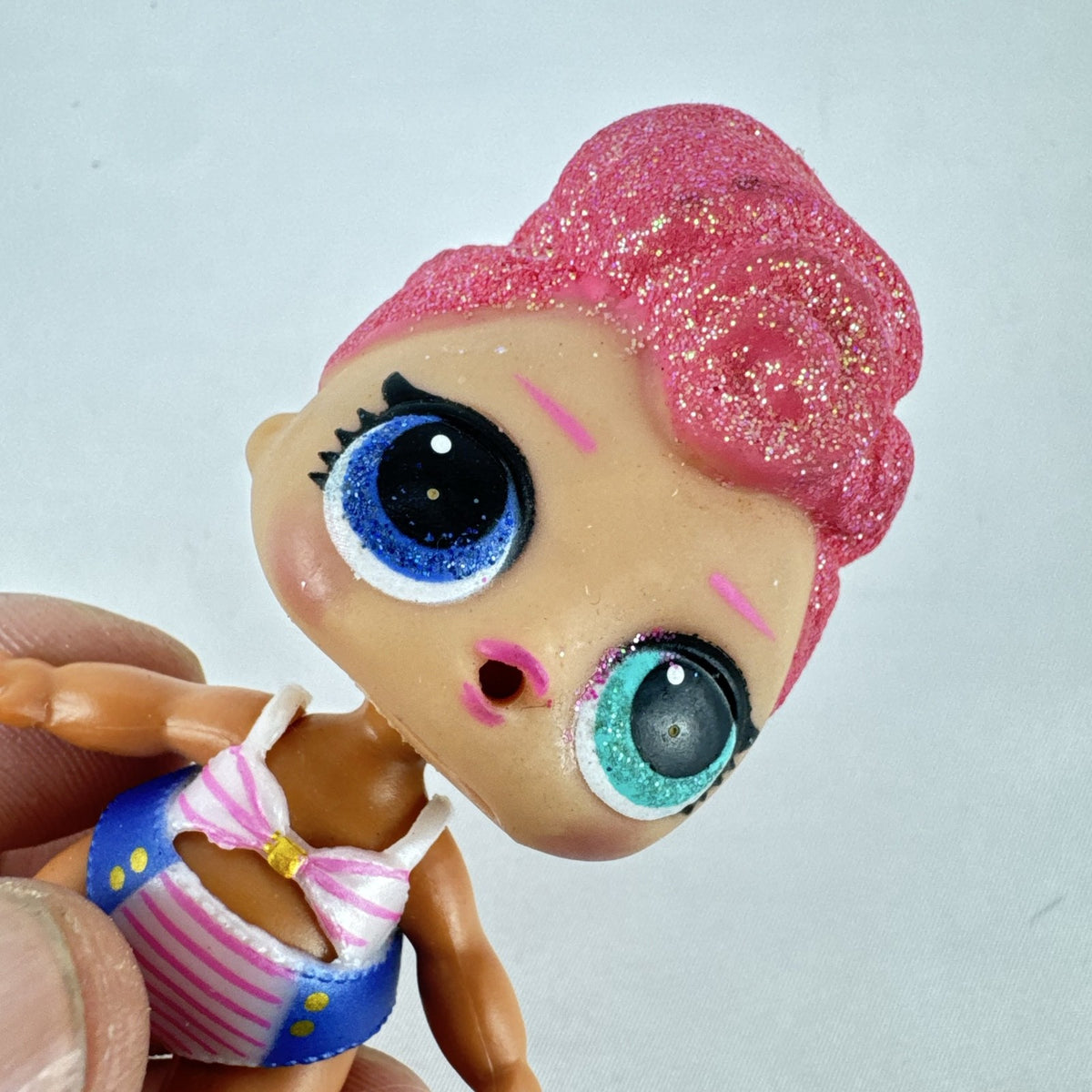 MGA L.O.L. Surprise High Dive doll with pink glitter hair and two-piece swimsuit