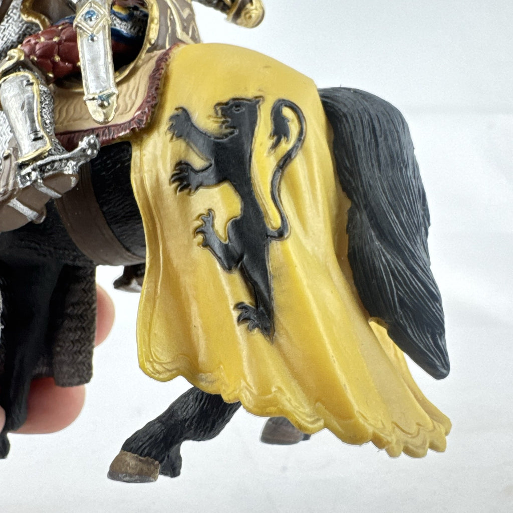 Schleich 2007 medieval knight figurine with sword and lion shield mounted on an armored warhorse