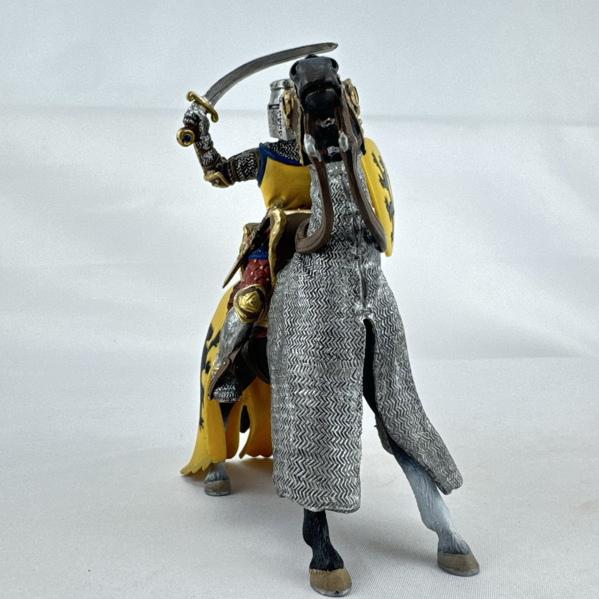 Schleich 2007 medieval knight figurine with sword and lion shield mounted on an armored warhorse