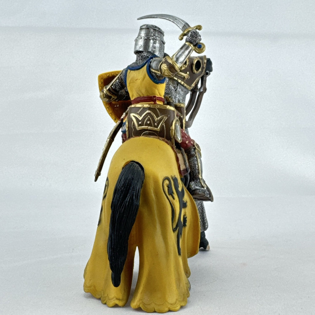 Schleich 2007 medieval knight figurine with sword and lion shield mounted on an armored warhorse