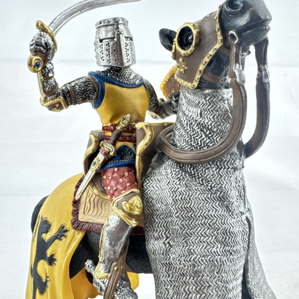 Schleich 2007 medieval knight figurine with sword and lion shield mounted on an armored warhorse