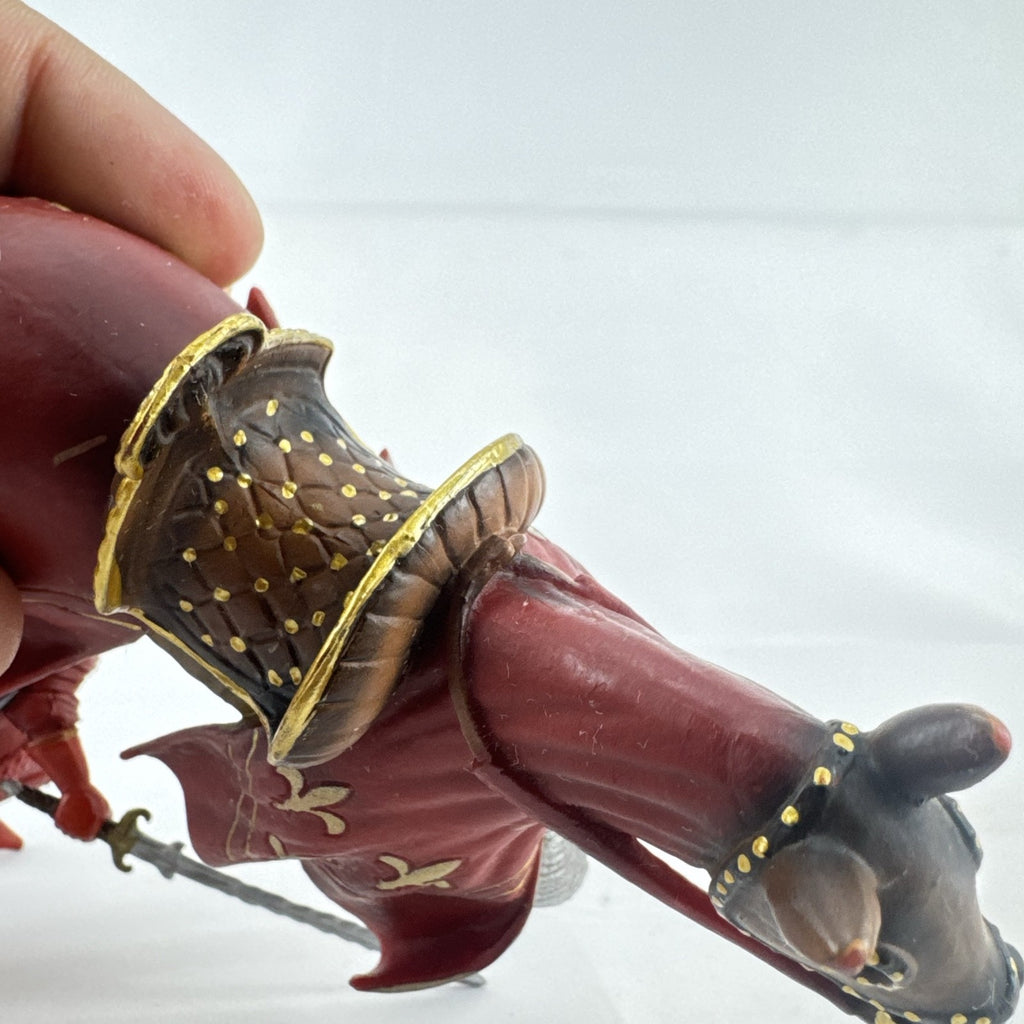Papo red horned knight holding sword mounted on a Schleich crimson fleur-de-lis barded war horse
